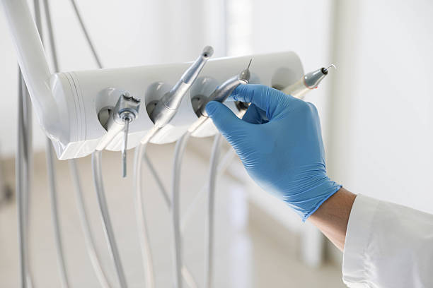 Professional Tooth Extraction technician working in East Lake, FL